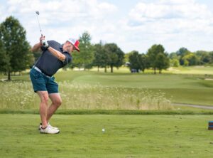 image of man taking a golf swing