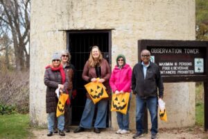 picture of adults for a Halloween activity at the School Forest