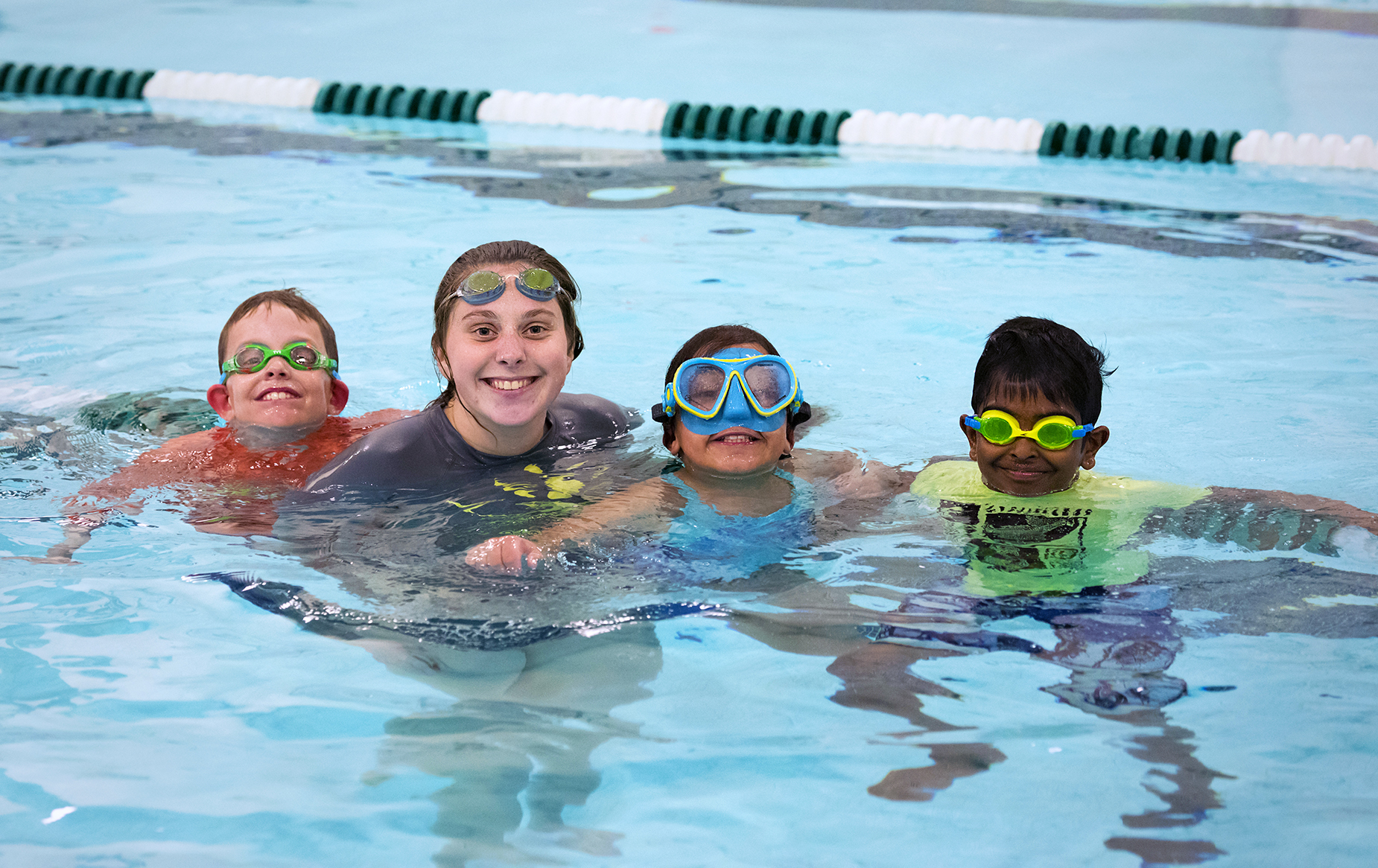 Four youths in a public swimming pool