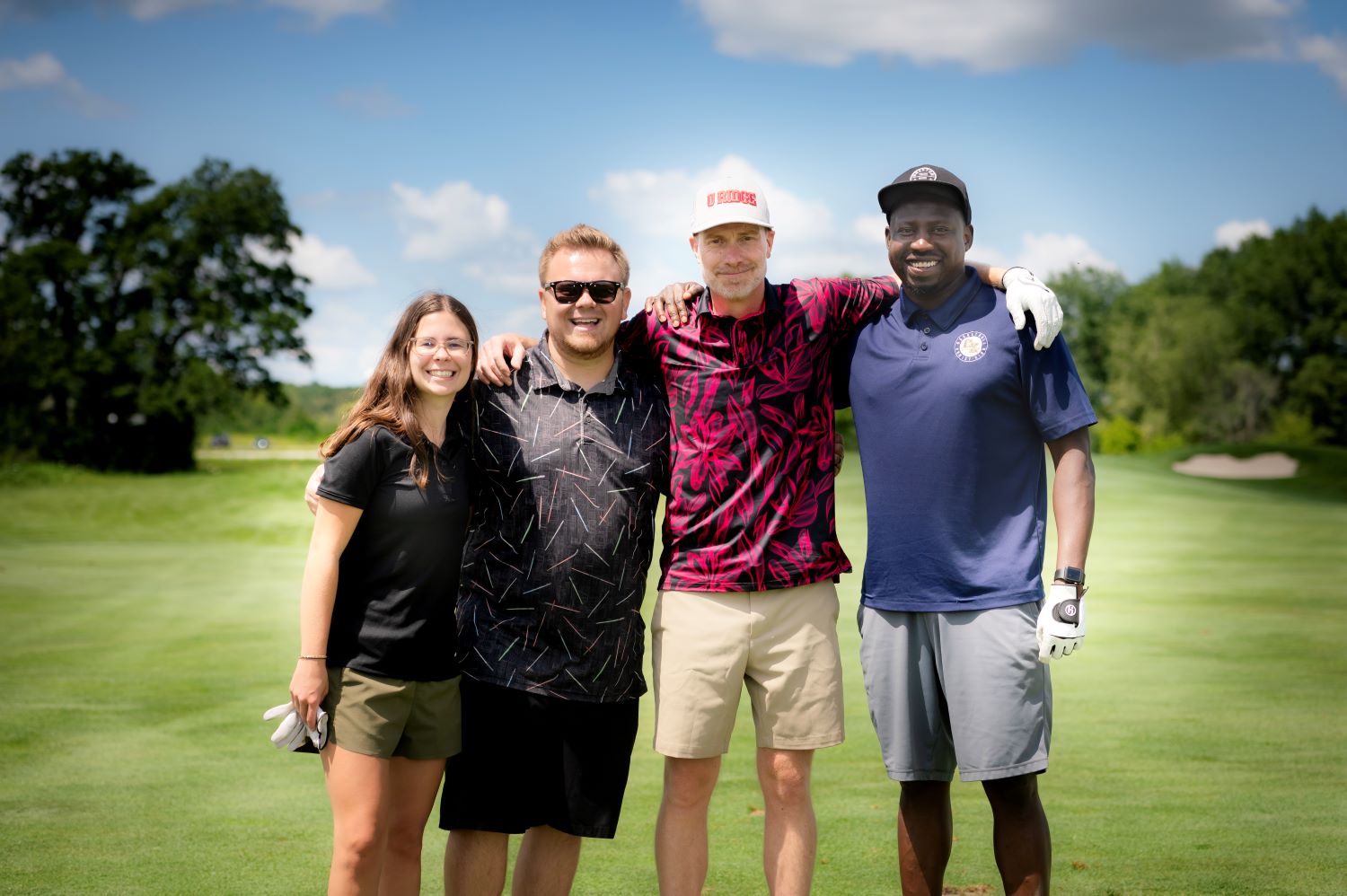 image of a team of 4 golfers on the course