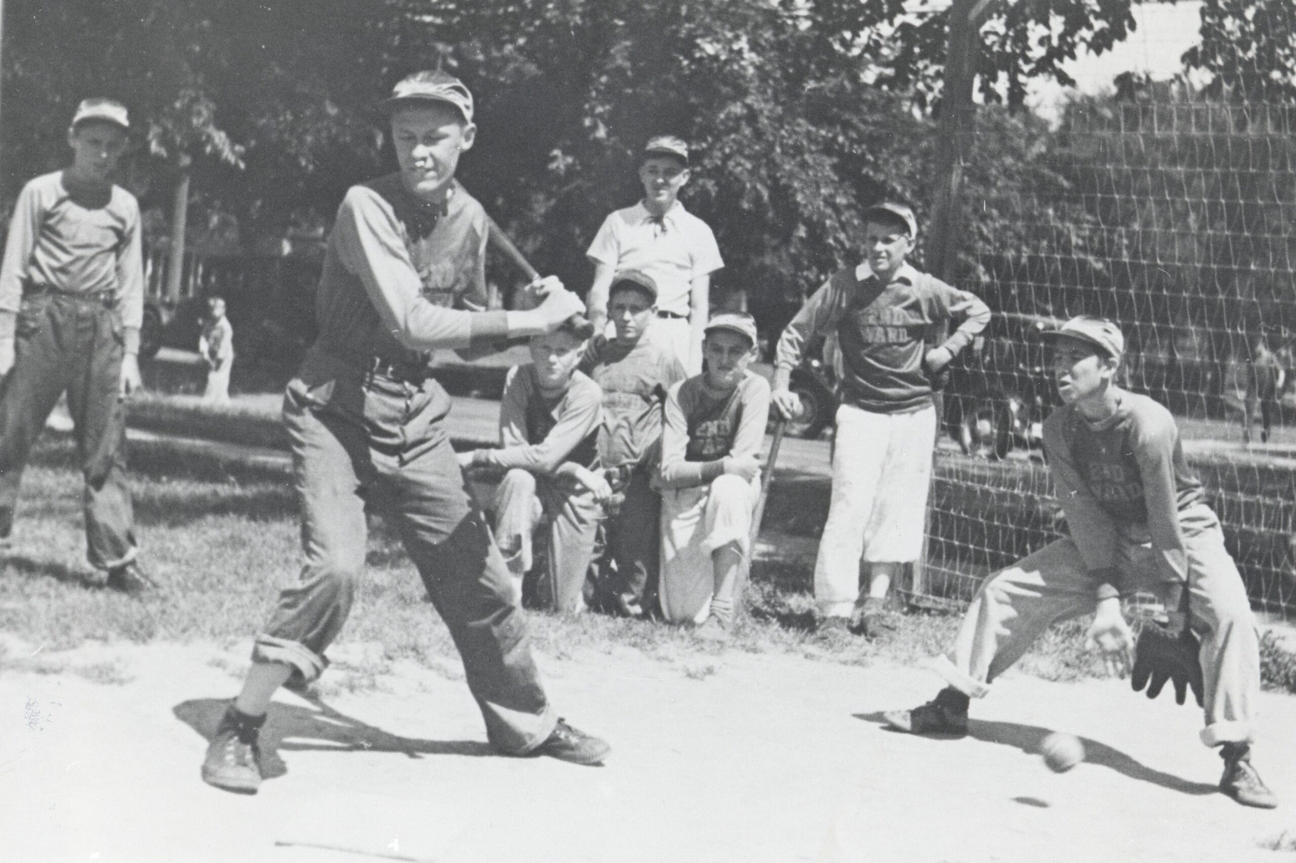 A historic picture of softball players playing a softball game