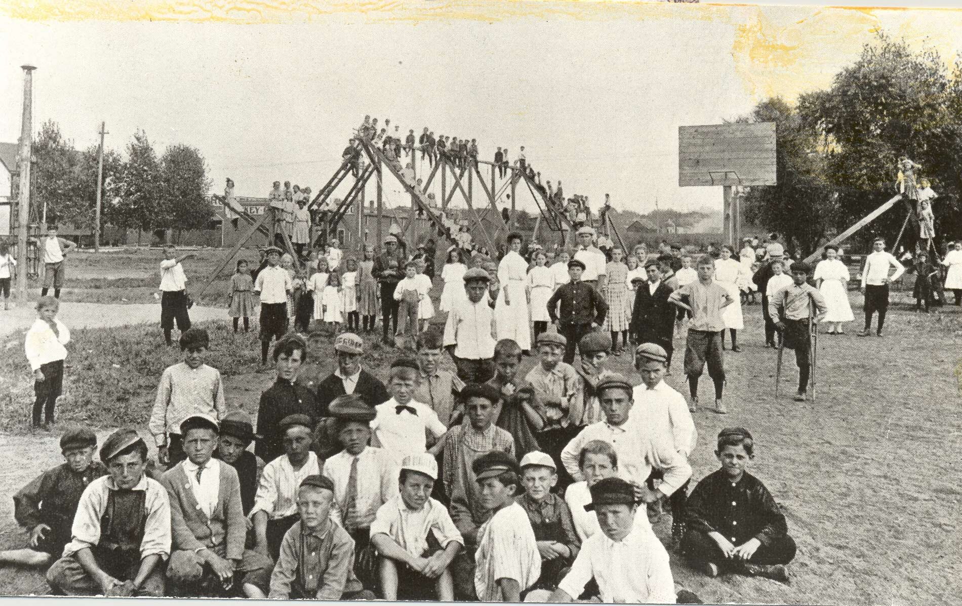 picture of children playing on a playground in 1906