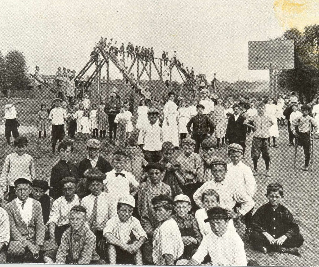 picture of children playing on a playground in 1906