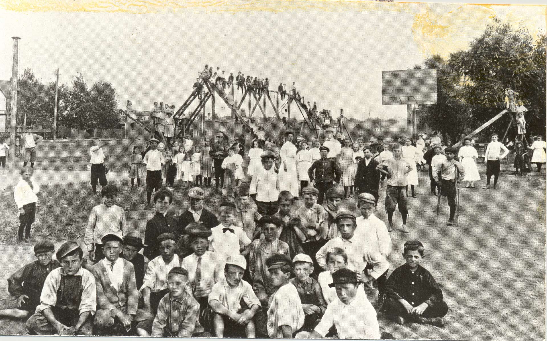 picture of children playing on a playground in 1906