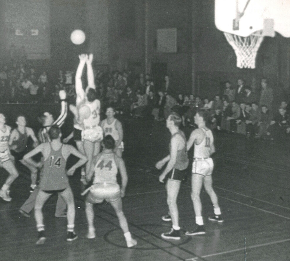 Men playing basketball in the gym